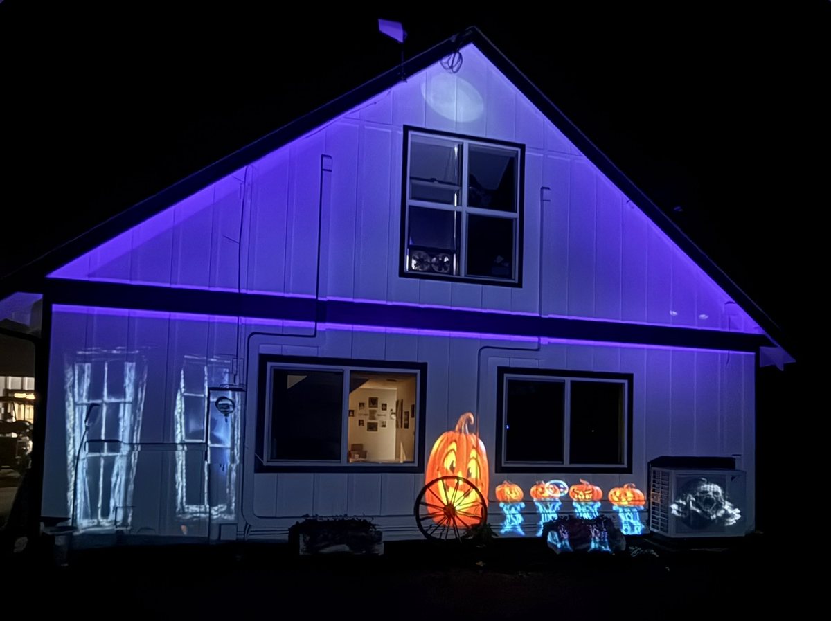 A house mapped with projected light, using LumiCanvas